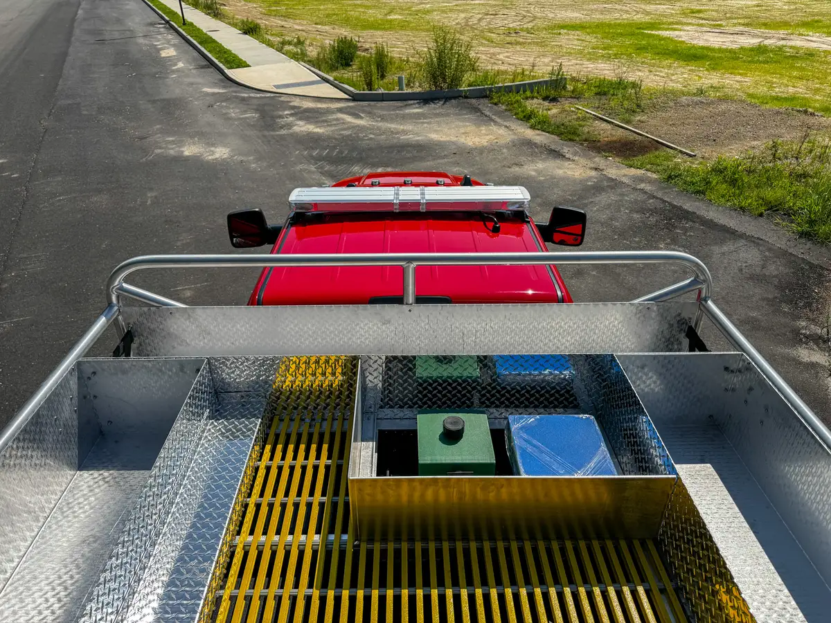 Top deck close-up with yellow grating panels and square hatch opening.
